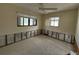 Small bedroom with wall damage and exposed framing at 9524 Treasure Ne Ln, St Petersburg, FL 33702