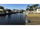 Peaceful canal-front view with private dock and boats at 9524 Treasure Ne Ln, St Petersburg, FL 33702