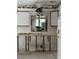 Kitchen undergoing renovation, showing exposed framing and plumbing at 9524 Treasure Ne Ln, St Petersburg, FL 33702