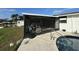 Screened pool area with adjacent shed at 9524 Treasure Ne Ln, St Petersburg, FL 33702