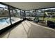 Spacious screened enclosure with pool access, overlooking canal views at 9524 Treasure Ne Ln, St Petersburg, FL 33702