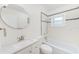 Bathroom with a bathtub, shower, and oval mirror at 9714 Skewlee Rd, Thonotosassa, FL 33592