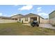 Large backyard with extended patio and four-wheeler at 12017 Gillingham Harbor Ln, Gibsonton, FL 33534
