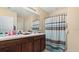 Bathroom with double vanity and shower stall at 12017 Gillingham Harbor Ln, Gibsonton, FL 33534