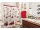 Clean bathroom with a holiday-themed shower curtain at 12017 Gillingham Harbor Ln, Gibsonton, FL 33534
