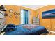 Bedroom with a full-size bed, lake view, and orange walls at 12017 Gillingham Harbor Ln, Gibsonton, FL 33534