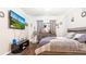 Bedroom with large TV, dresser and comfortable bed at 12017 Gillingham Harbor Ln, Gibsonton, FL 33534