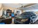 Garage with car, couch, and storage shelving at 12017 Gillingham Harbor Ln, Gibsonton, FL 33534