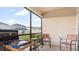 Screened patio with seating and grill at 12017 Gillingham Harbor Ln, Gibsonton, FL 33534