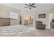 Bright bedroom with a king-size bed and sliding glass doors leading to a balcony at 12077 Gandy N Blvd # 344, St Petersburg, FL 33702