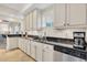 Modern kitchen with ample cabinetry and granite countertops at 12077 Gandy N Blvd # 344, St Petersburg, FL 33702