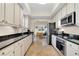 Modern kitchen with stainless steel appliances and granite countertops at 12077 Gandy N Blvd # 344, St Petersburg, FL 33702