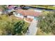 House with a landscaped yard and driveway, situated near a canal at 1210 Lady Elaine Dr, Valrico, FL 33594