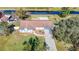 Aerial view of a single-Gathering home on a canal, showcasing the property and surrounding area at 1210 Lady Elaine Dr, Valrico, FL 33594