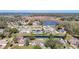Aerial view showcasing the property's location in a quiet neighborhood near a lake at 1210 Lady Elaine Dr, Valrico, FL 33594