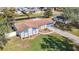 Single-Gathering home with landscaped yard and canal view from above at 1210 Lady Elaine Dr, Valrico, FL 33594