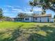 House exterior view showcasing backyard and screened porch at 1210 Lady Elaine Dr, Valrico, FL 33594