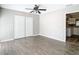 Spacious bedroom with wood-look floors and access to kitchen at 1210 Lady Elaine Dr, Valrico, FL 33594