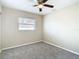 Simple bedroom with carpet floors and a window with blinds at 1210 Lady Elaine Dr, Valrico, FL 33594