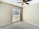 Well-lit bedroom with ceiling fan and window covering at 1210 Lady Elaine Dr, Valrico, FL 33594