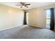 Cozy bedroom with carpet flooring and a window with curtains at 1210 Lady Elaine Dr, Valrico, FL 33594