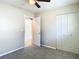 Charming bedroom with carpet floors and an adjacent room at 1210 Lady Elaine Dr, Valrico, FL 33594