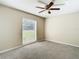 Bedroom with ceiling fan, window with blinds, and carpet flooring at 1210 Lady Elaine Dr, Valrico, FL 33594