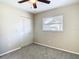 Well-lit bedroom with carpet and double door closet at 1210 Lady Elaine Dr, Valrico, FL 33594