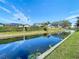 Peaceful canal view with lush greenery and blue sky at 1210 Lady Elaine Dr, Valrico, FL 33594