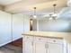 Bright kitchen with white cabinets, stainless steel appliances, and light countertops at 1210 Lady Elaine Dr, Valrico, FL 33594