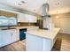 Updated kitchen with white cabinets and a large island at 1210 Lady Elaine Dr, Valrico, FL 33594