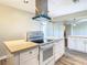 Modern kitchen with white cabinets, stainless steel appliances, and quartz countertops at 1210 Lady Elaine Dr, Valrico, FL 33594
