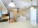 Modern kitchen with white cabinets, island, and stainless steel appliances at 1210 Lady Elaine Dr, Valrico, FL 33594
