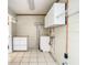 Bright laundry room with washer and dryer hookups, cabinets, and ample storage at 1210 Lady Elaine Dr, Valrico, FL 33594