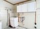 Functional laundry room, includes sink and storage cabinets at 1210 Lady Elaine Dr, Valrico, FL 33594