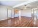 Open living room with hardwood floors and access to the kitchen at 1210 Lady Elaine Dr, Valrico, FL 33594
