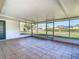 Large screened porch with tiled floor and views of backyard at 1210 Lady Elaine Dr, Valrico, FL 33594
