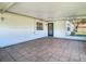 Covered porch with tiled flooring and access to backyard at 1210 Lady Elaine Dr, Valrico, FL 33594