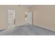 Bright bedroom with grey carpet and access to bathroom at 17108 Carrington Park Dr # 710, Tampa, FL 33647