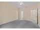 Spacious bedroom with grey carpet and ceiling fan at 17108 Carrington Park Dr # 710, Tampa, FL 33647