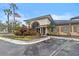 Community clubhouse entrance with landscaping at 17108 Carrington Park Dr # 710, Tampa, FL 33647