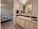 Bathroom with single sink vanity, shower/tub combo and vinyl flooring at 209 N Saint Thomas Cir, Apollo Beach, FL 33572