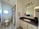 Bathroom with toilet, shower/tub combo and vanity at 209 N Saint Thomas Cir, Apollo Beach, FL 33572
