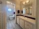 Bathroom with updated vanity and walk-in shower at 209 N Saint Thomas Cir, Apollo Beach, FL 33572