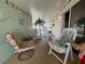 Relaxing covered patio with comfy seating, perfect for enjoying the Florida weather at 209 N Saint Thomas Cir, Apollo Beach, FL 33572