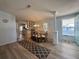 Charming dining area with a glass table and four chairs at 209 N Saint Thomas Cir, Apollo Beach, FL 33572