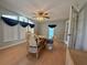 Bright dining room with wicker chairs and a glass-top table at 209 N Saint Thomas Cir, Apollo Beach, FL 33572