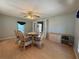Dining room with wicker chairs and glass-top dining table at 209 N Saint Thomas Cir, Apollo Beach, FL 33572