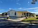 Immaculately maintained manufactured home with carport and covered patio at 209 N Saint Thomas Cir, Apollo Beach, FL 33572