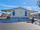 Well-maintained exterior of a single-wide manufactured home with carport at 209 N Saint Thomas Cir, Apollo Beach, FL 33572